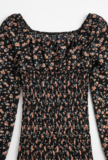 Black floral smocked dress – neckline and smocking detail, white background