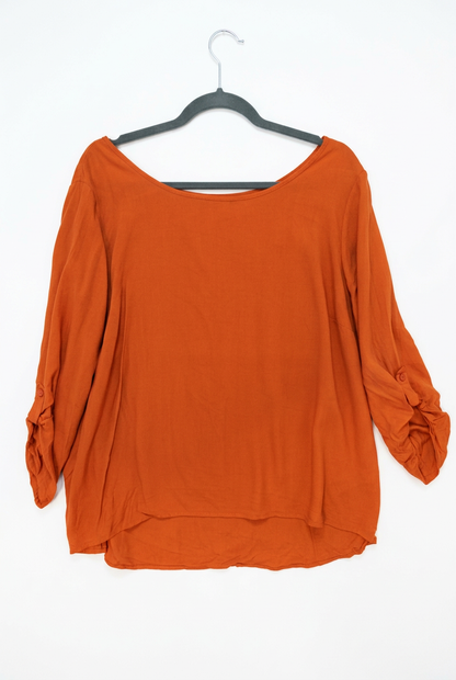 Orange blouse size L on hanger – front view, white background